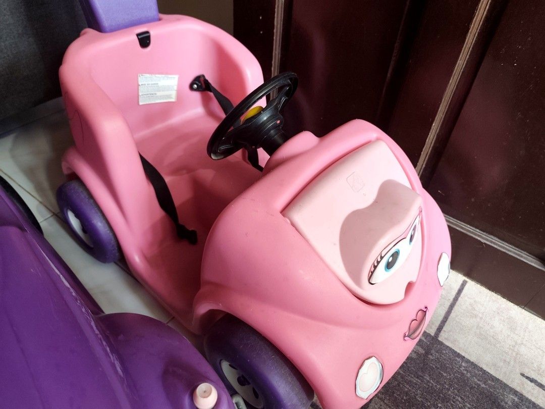 Little Tikes Step 2 Stroller Car (Category: Infant Playtime) located in Manila. Submitted by declutterbabythings (Listing ID 1409758420, Image 1). Description: Listing includes a Little Tikes and a Step 2 stroller car. The pink car has a steering wheel and a seatbelt. The purple car has a steering wheel. Both cars are designed for children. The Step 2 car has a handle for pushing. The price for each car is 3800..