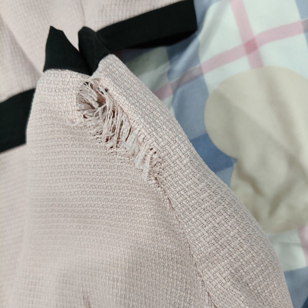 Lovito Pink Halter Dress (with damage) (Category: Dresses) located in Bulacan. Submitted by nocturnaaa (Listing ID 1409727733, Image 3). Description: BRAND NEW but with fixable damaged. - Lovito pink halter dress - Black trim and cut-out design - Flared skirt - Tie-up halter straps - Textured fabric - Condition: Visible damage.