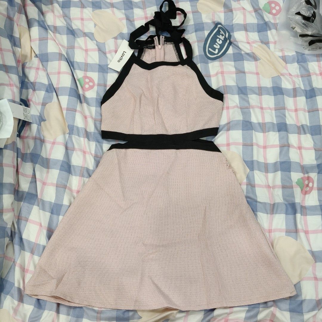 Lovito Pink Halter Dress (with damage) (Category: Dresses) located in Bulacan. Submitted by nocturnaaa (Listing ID 1409727733, Image 2). Description: BRAND NEW but with fixable damaged. - Lovito pink halter dress - Black trim and cut-out design - Flared skirt - Tie-up halter straps - Textured fabric - Condition: Visible damage.