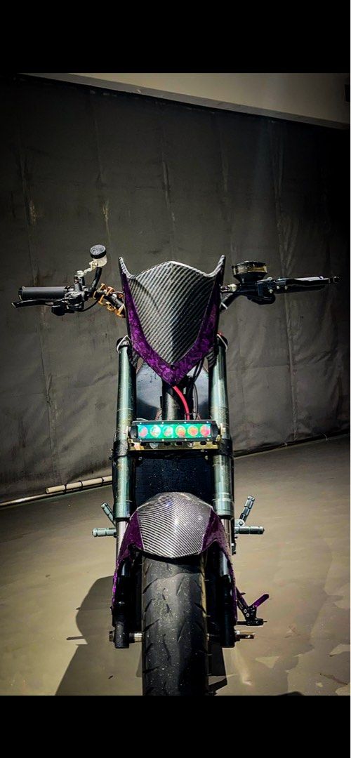 m3 setup (Category: E-Scooters & E-Bikes) located in Singapore. Submitted by zzstoic (Listing ID 1409764238, Image 3). Description: 72450 Fardriver 4.5kw v4 qs changed the front light to 6bulb all purple parts are wrapped by myself what u see is what u get zipties all changed to black everything +chop working just maybe need to make the box neater 👍🏽 PM ME I WONT BITE ! RFS : some cb stole my batt hence decide to sell and quit + need funds for 