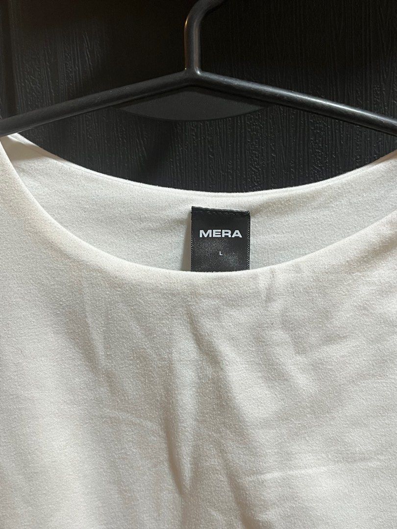 Mera White T-shirt - Size L (Category: Shirts) located in Manila. Submitted by xoshushi.dcltr (Listing ID 1409787348, Image 2). Description: Double lining shirt large on tag but fit sa medium.