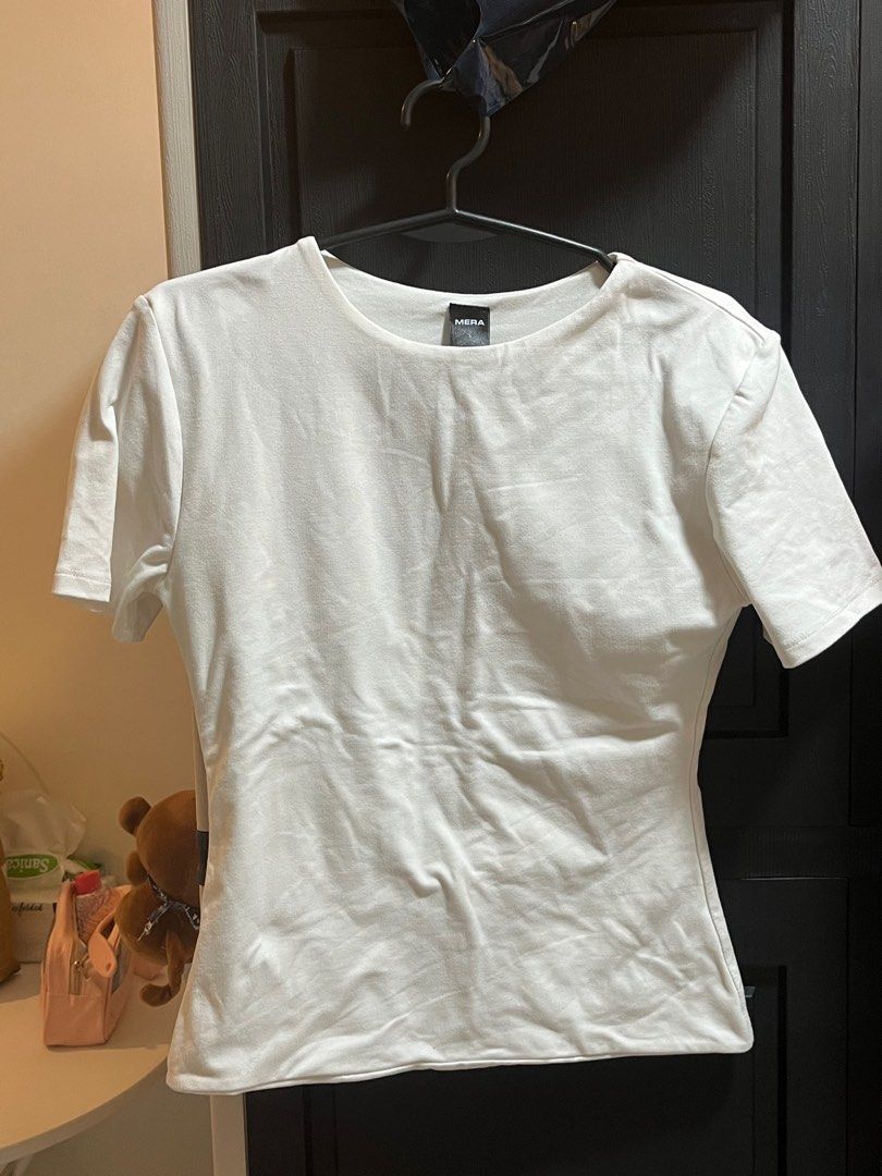 Mera White T-shirt - Size L (Category: Shirts) located in Manila. Submitted by xoshushi.dcltr (Listing ID 1409787348, Image 1). Description: Double lining shirt large on tag but fit sa medium.