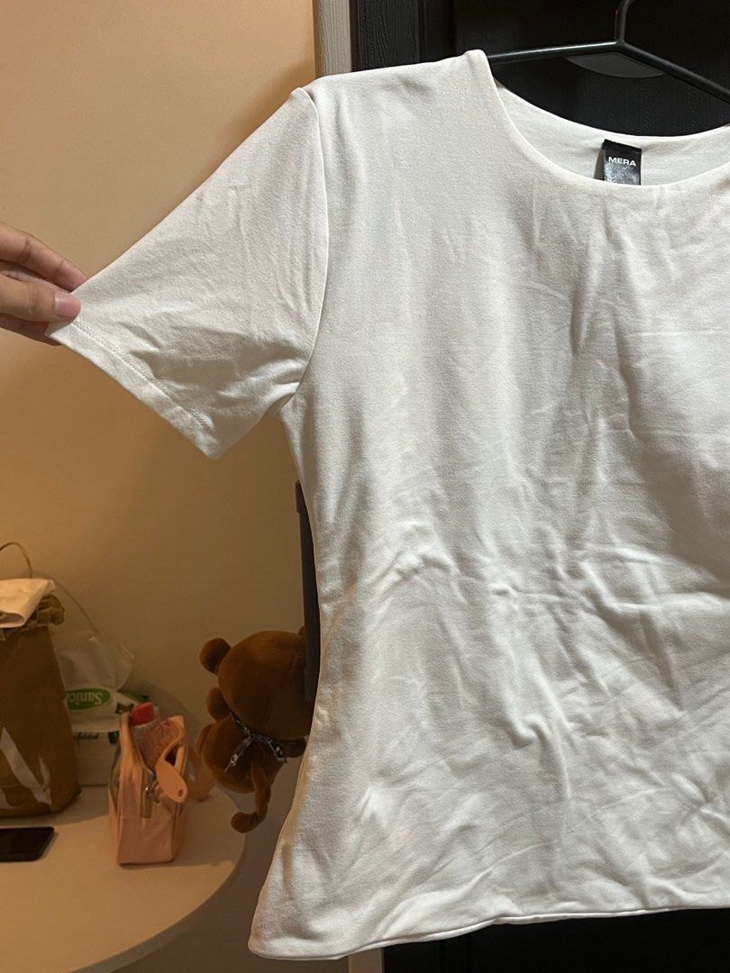 Mera White T-shirt - Size L (Category: Shirts) located in Manila. Submitted by xoshushi.dcltr (Listing ID 1409787348, Image 3). Description: Double lining shirt large on tag but fit sa medium.