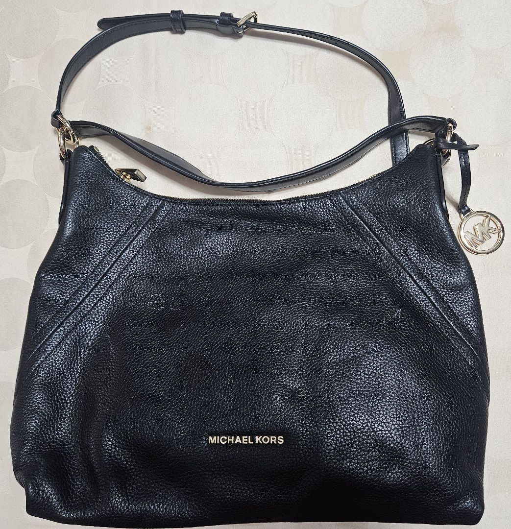Michael Kors Aria Pebbled Leather Shoulder Bag (Category: Luxury Bags & Wallets) located in Makati City. Submitted by KuWeLaDevil01 (Listing ID 1409642820, Image 1). Description: All Authentic set with original zippers, dust bag (can be washed), trim and the all-important MK Key chain and insignia. The key chain has no nicks and is still shiny as ever, they do not show any visible scratches. Pebbled leather that is rugged but feels very nice to b