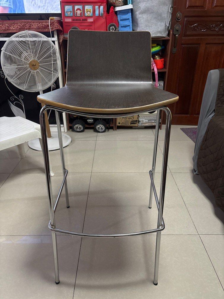Modern Bar Stool/High Chair with Chrome Legs (Category: Chairs) located in Quezon City. Submitted by jaedenry0228 (Listing ID 1409686237, Image 1). Description: - Dark brown seat and backrest - Sleek design with chrome-finished metal frame - Includes a footrest - Curved seat for comfortable seating - Perfect for kitchen counters or home bars - 2pcs available - 4k for both.