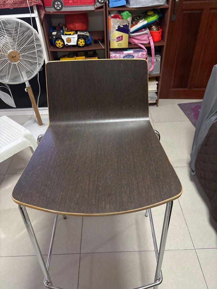 Modern Bar Stool/High Chair with Chrome Legs (Category: Chairs) located in Quezon City. Submitted by jaedenry0228 (Listing ID 1409686237, Image 2). Description: - Dark brown seat and backrest - Sleek design with chrome-finished metal frame - Includes a footrest - Curved seat for comfortable seating - Perfect for kitchen counters or home bars - 2pcs available - 4k for both.