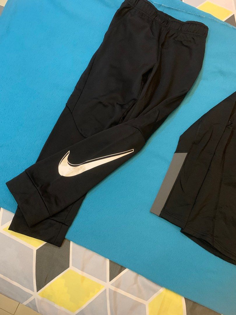 Nike Dri-FIT Tracksuit Set - Black (Category: Babies & Kids Fashion) located in Cainta. Submitted by JCJ_shoppe (Listing ID 1409639973, Image 2). Description: ORIGINAL Nike Dri-FIT tracksuit set - Color: Black - Includes: Long-sleeved top and pants - Size: M (fits 10-12 year olds) - Features Nike logos on top and pants - Accents: Grey on sleeves and collar - No flaws / damage.