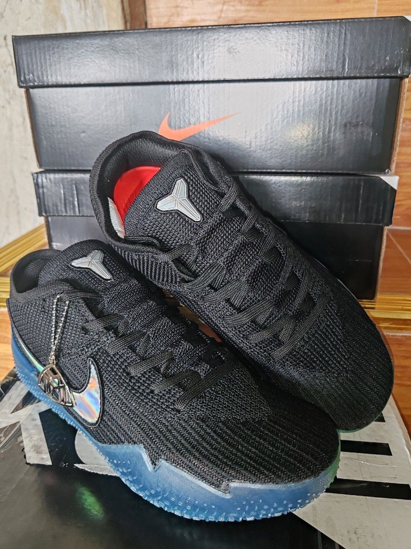Nike Kobe AD NXT 360 Black Silver (Category: Sneakers) located in Baguio. Submitted by pop_up_items (Listing ID 1409716163, Image 2). Description: - Nike Kobe AD NXT 360 sneakers - Black knit upper - Holographic swoosh - Blue and green sole - Size: 8.5 (US) - Includes original box.