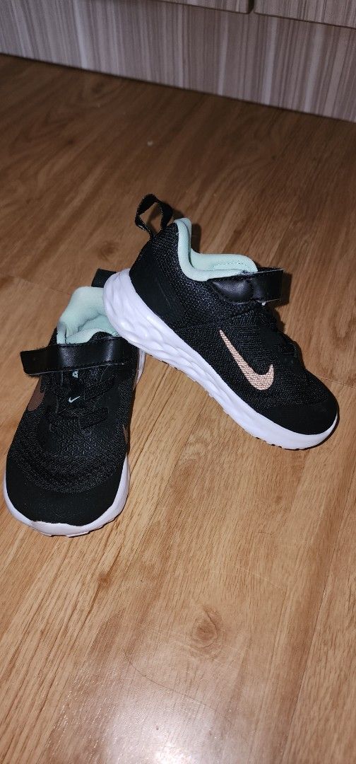 Nike Toddler Shoes Black (Category: Babies & Kids Fashion) located in Imus. Submitted by sashafame (Listing ID 1409689472, Image 1). Description: - Black Nike toddler shoes - White sole - Hook-and-loop strap for easy wear - Light green interior - Nike logo on the side -6c size.