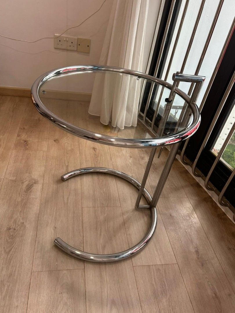 Side table (Category: Other Home Furniture) located in Singapore. Submitted by cllll03 (Listing ID 1388117261, Image 3). Description: Moderen round side coffee table for sale. Glass top, steel (glossy finish) stand (abit tarnish),still in good working condition.