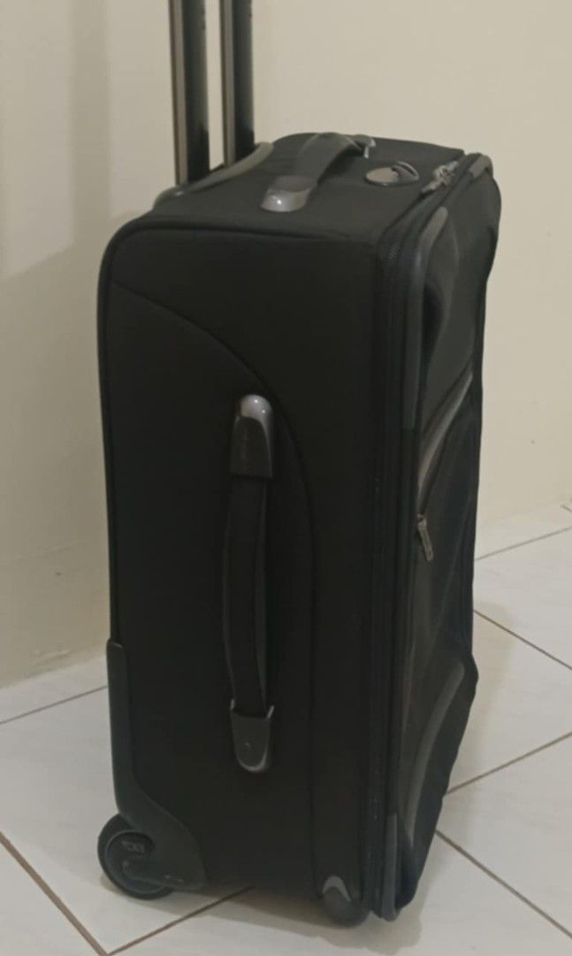 TUMI luggage (Category: Luxury Bags & Wallets) located in Legazpi City. Submitted by georgepine07142 (Listing ID 1409689994, Image 2). Description: Preloved TUMI Luggage A reliable and practical travel essential from TUMI, perfect for frequent travelers. Designed with a very spacious main compartment and multiple pockets for organized packing. Features a TUMI plate inside the exterior pocket and TUMI-branded hardware, reflecting its quality craft