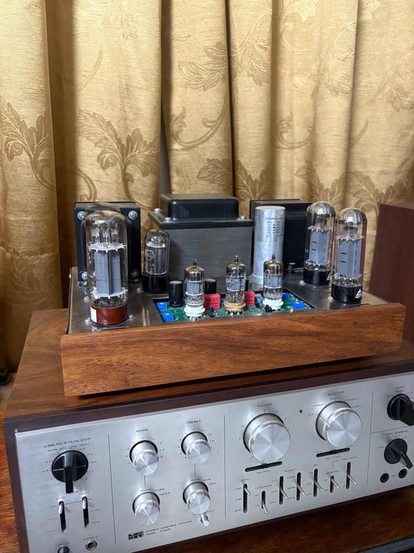 Vintage Tube Amplifier (Category: Soundbars, Speakers & Amplifiers) located in Lipa City. Submitted by daved16 (Listing ID 1409636162, Image 2). Description: - Vintage tube amplifier - Wooden base - Silver faceplate - Multiple tubes - Bass, treble, and volume controls - Linear equalizer.