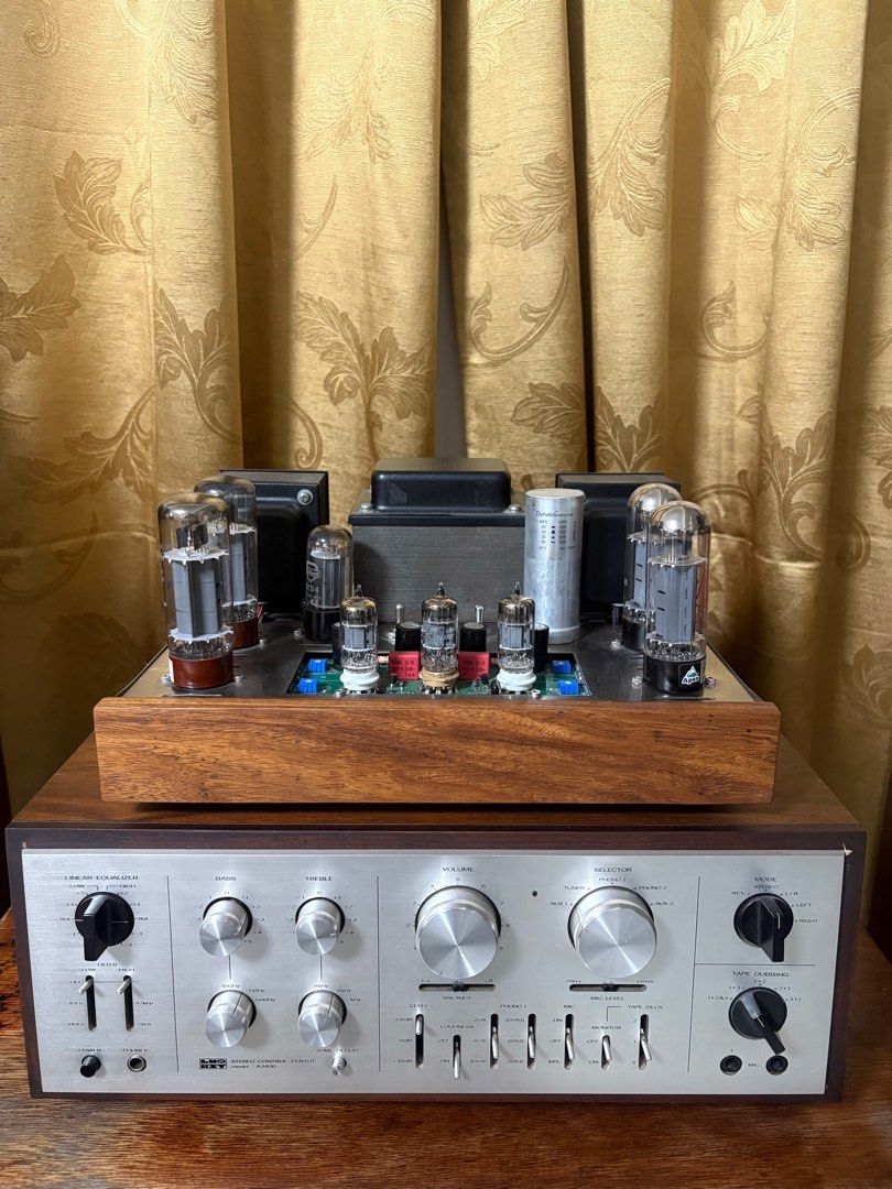 Vintage Tube Amplifier (Category: Soundbars, Speakers & Amplifiers) located in Lipa City. Submitted by daved16 (Listing ID 1409636162, Image 3). Description: - Vintage tube amplifier - Wooden base - Silver faceplate - Multiple tubes - Bass, treble, and volume controls - Linear equalizer.