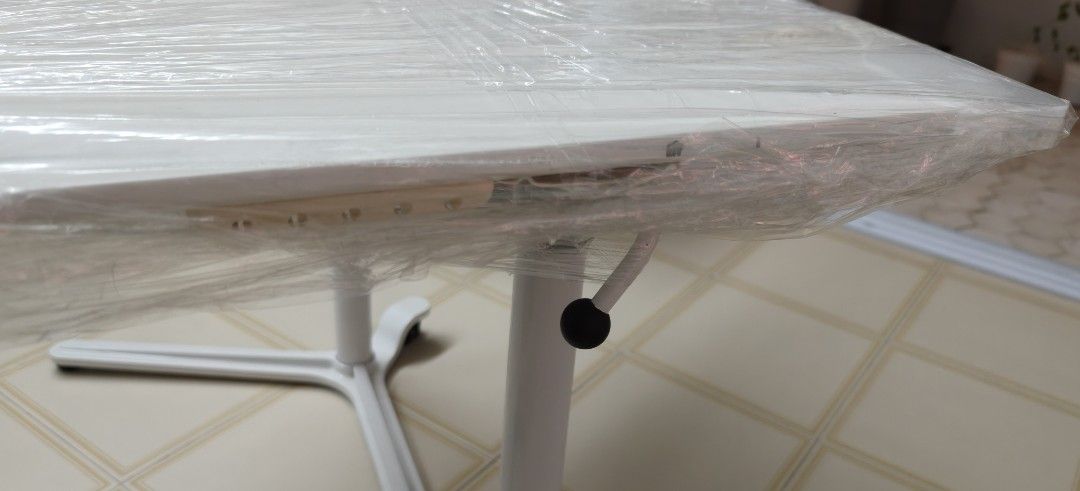 White Adjustable Table (Category: Tables & Sets) located in Singapore. Submitted by graphickers (Listing ID 1409757243, Image 1). Description: - like new, white adjustable table - Still in original protective plastic wrap - Features a convenient height adjustment lever - Unique and stylish base design - self collect .