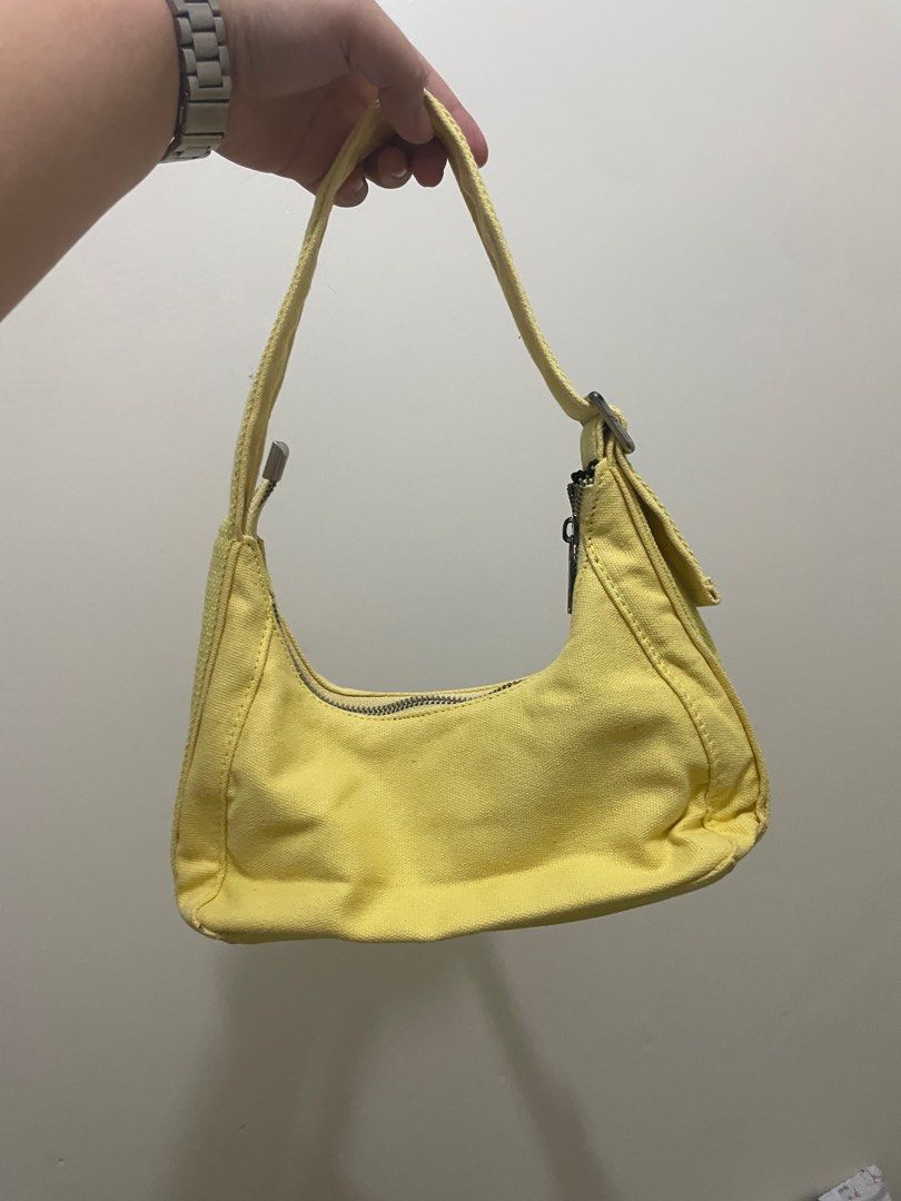 Yellow Shoulder Bag (Category: Shoulder Bags) located in Manila. Submitted by ragssurplus (Listing ID 1409621934, Image 2). Description: - REGEN shoulder bag in yellow - Two front pockets - Zippered main compartment - Black interior - Canvas-like material - Shoulder strap included - Small flap with magnetic closure.