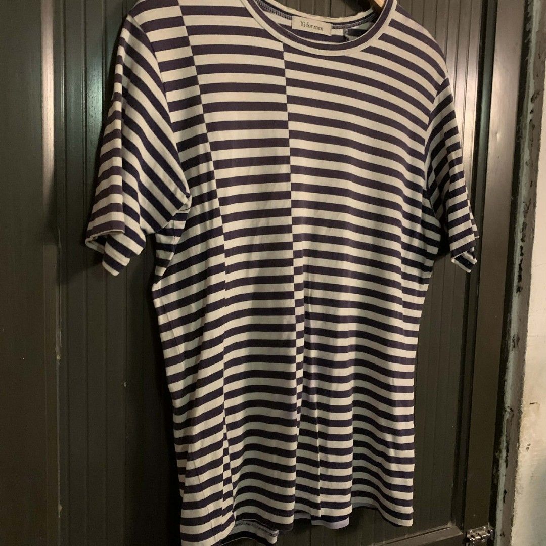 Y's for men Striped T-shirt (Category: Tshirts & Polo Shirts ) located in Carmen. Submitted by don-lean22 (Listing ID 1409712764, Image 2). Description: Y's for men striped T-shirt. Features a navy and white striped pattern. The shirt has a round neck and short sleeves. There is a visible stain on the front of the shirt. The brand label is visible on the inside of the collar. Have minimal issue stain Pristine condition .