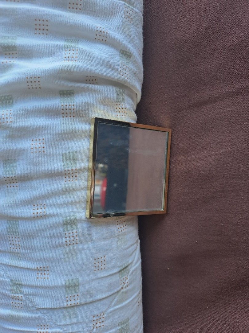 YSL Beauté Compact Mirror (Category: Mirrors) located in Manila. Submitted by joanbalde39643 (Listing ID 1409675221, Image 3). Description: - YSL Beauté compact mirror - Gold-colored frame - Features the YSL logo - Includes a black pouch with the YSL logo - Square-shaped.
