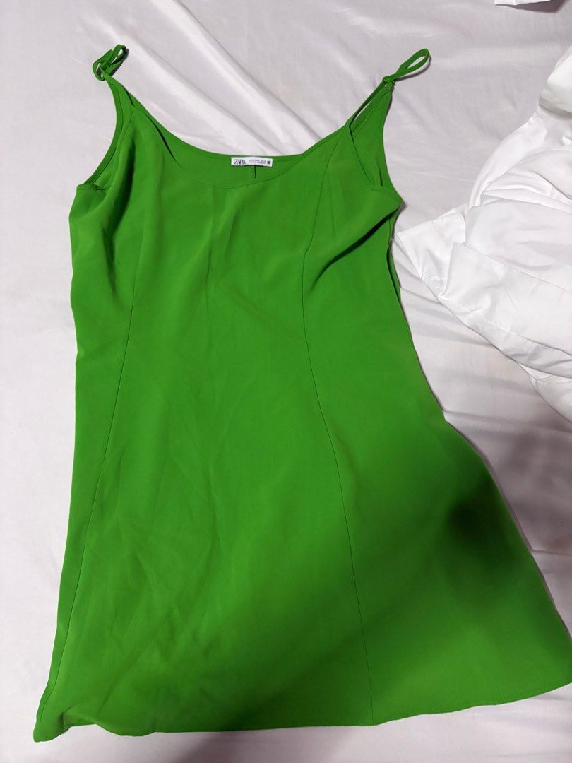 Zara Green Slip Dress (Category: Dresses) located in Quezon City. Submitted by authentic_c (Listing ID 1409719390, Image 1). Description: - Zara green slip dress - Size: L - Features adjustable straps - Flattering silhouette - Versatile for casual or evening wear - Lightweight and comfortable fabric.