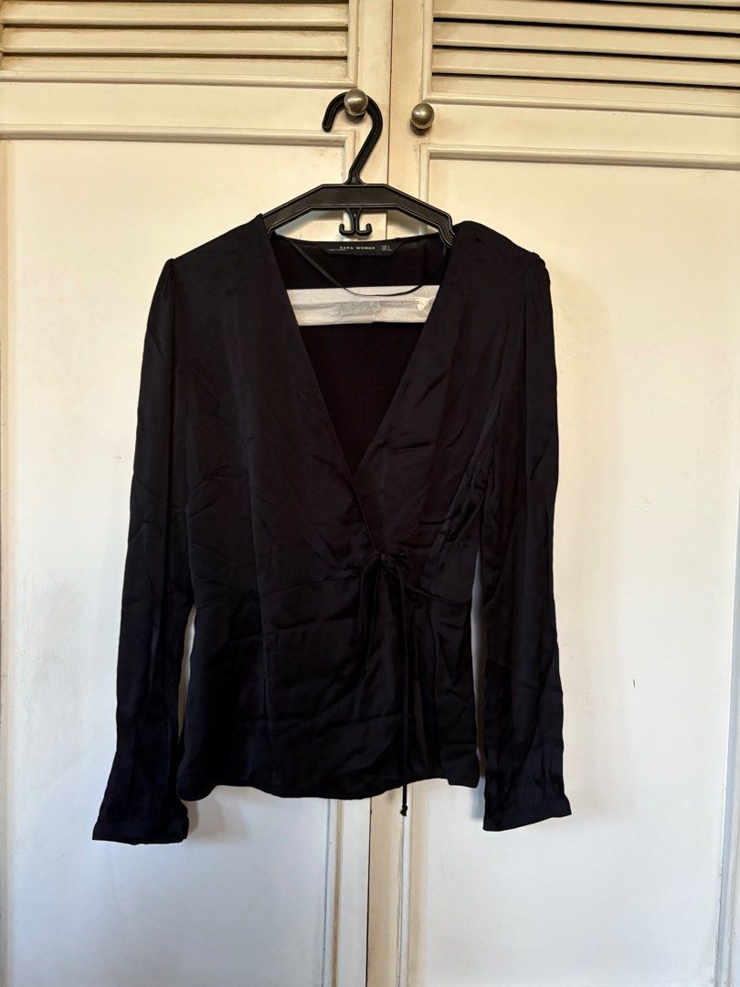 Zara Woman Black Blouse (Category: Blouses) located in Quezon City. Submitted by mcpar9685821 (Listing ID 1409727388, Image 1). Description: •worn only a few times, still in very good condition •satin-like material •very lightweight and breezy •low-cut; closed with a discreet button, not just a tie, for security .