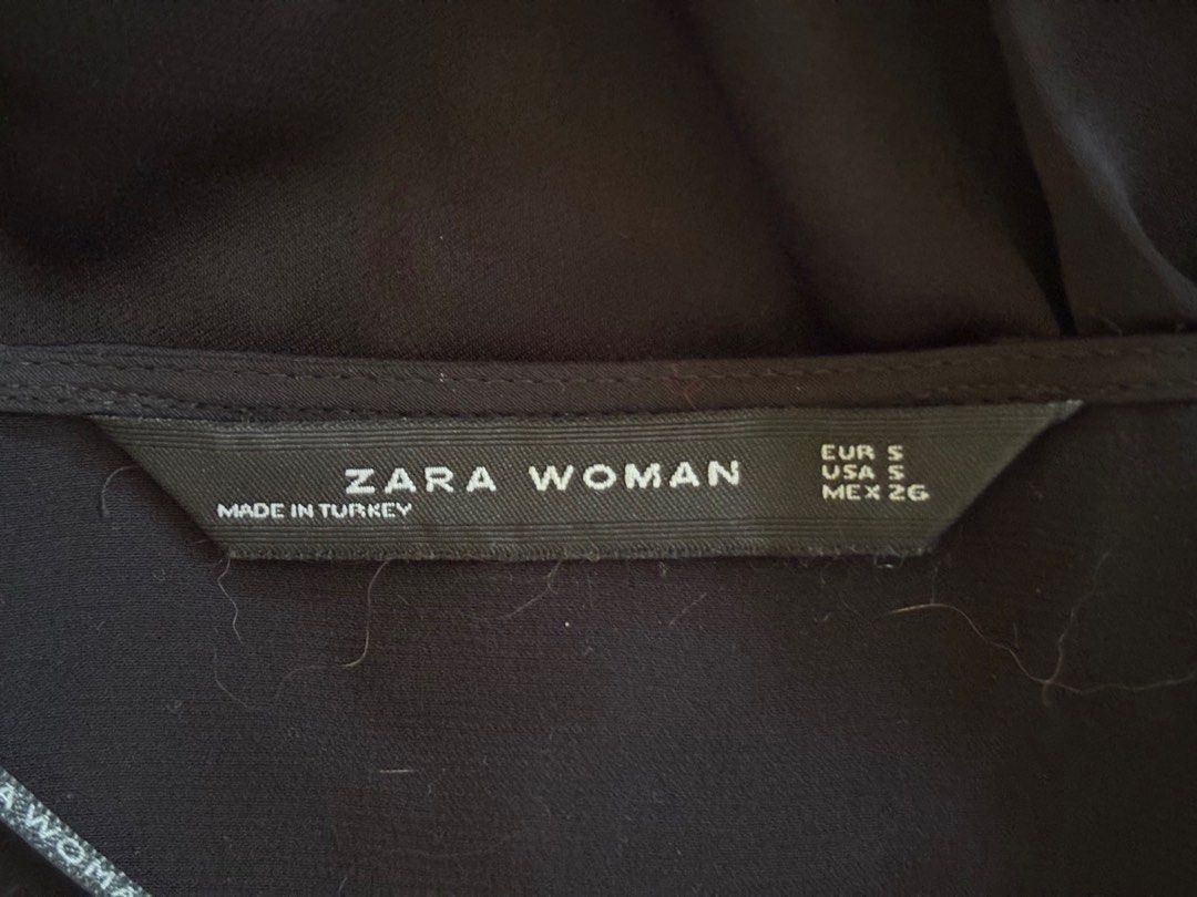 Zara Woman Black Blouse (Category: Blouses) located in Quezon City. Submitted by mcpar9685821 (Listing ID 1409727388, Image 3). Description: •worn only a few times, still in very good condition •satin-like material •very lightweight and breezy •low-cut; closed with a discreet button, not just a tie, for security .