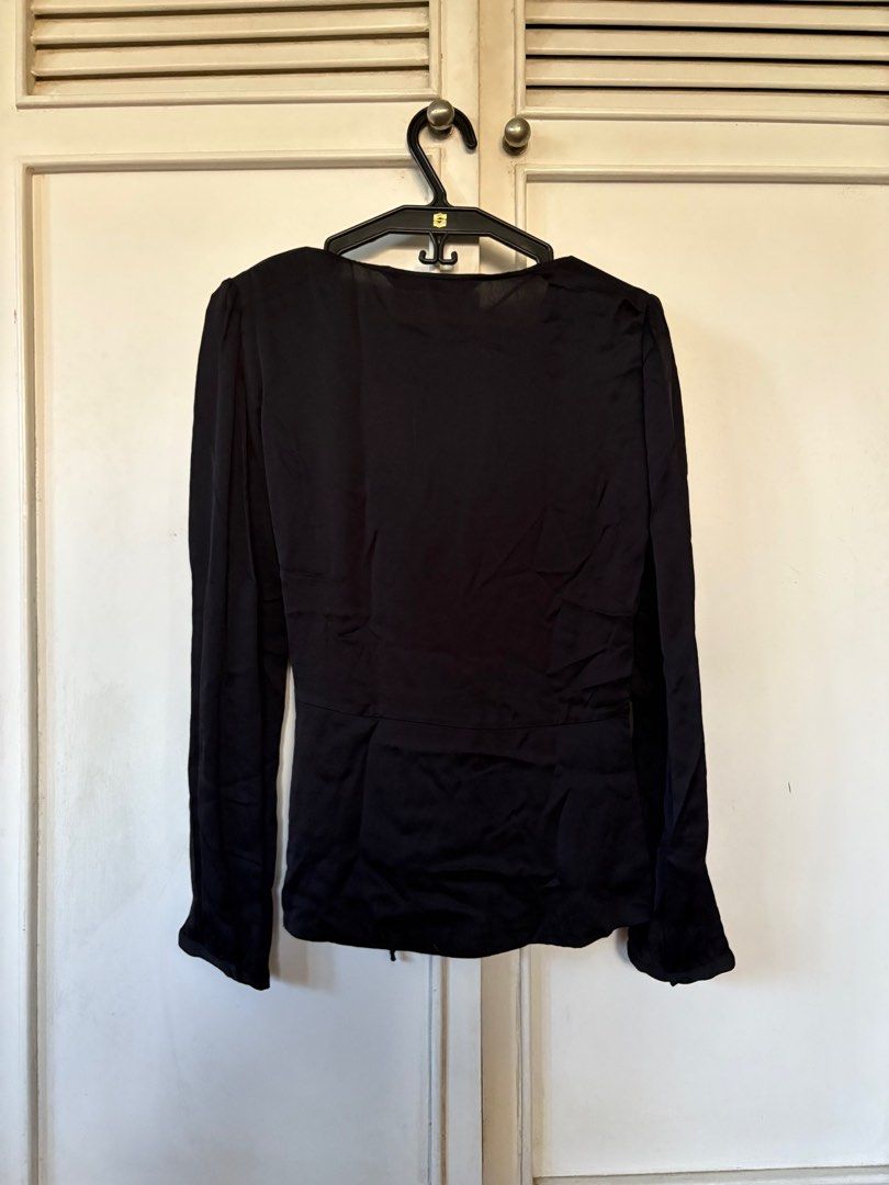 Zara Woman Black Blouse (Category: Blouses) located in Quezon City. Submitted by mcpar9685821 (Listing ID 1409727388, Image 2). Description: •worn only a few times, still in very good condition •satin-like material •very lightweight and breezy •low-cut; closed with a discreet button, not just a tie, for security .