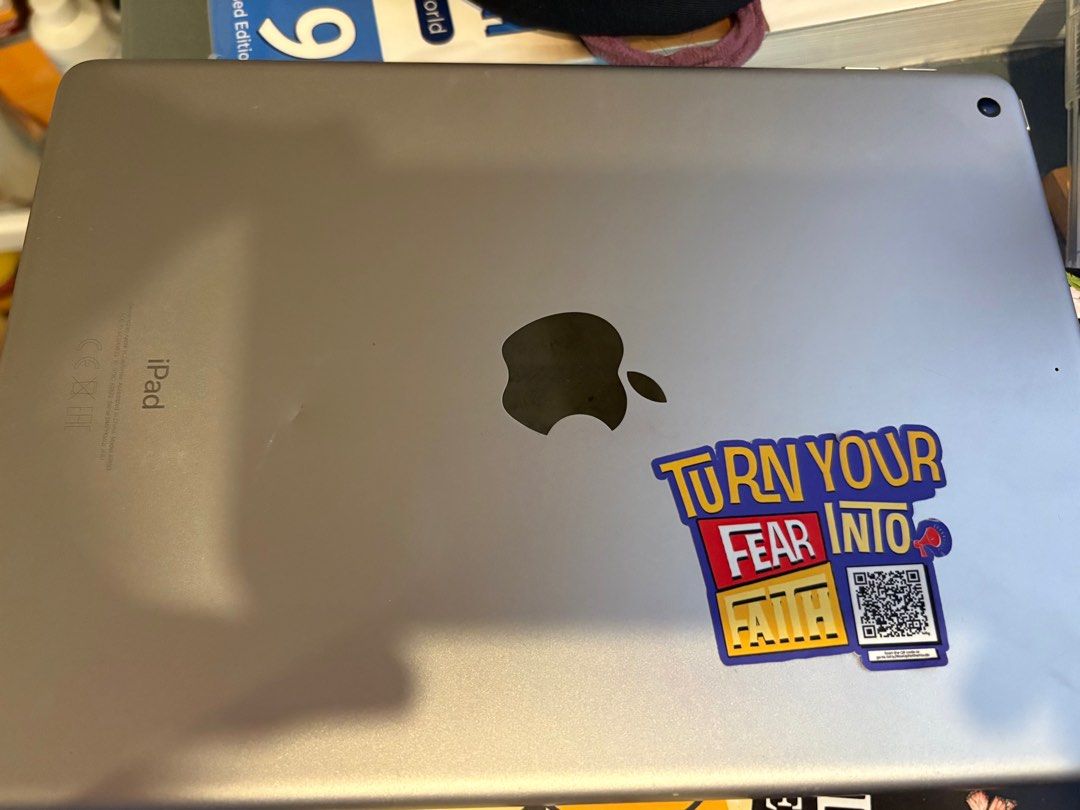 Apple iPad (Category: iPad) located in Cavite. Submitted by louiessaliviac (Listing ID 1409994048, Image 2). Description: - Apple iPad - Good working condition - Pre-installed apps: Spotify, Netflix, Facebook - Ideal for entertainment and productivity - Features Apple logo and sticker on the back.