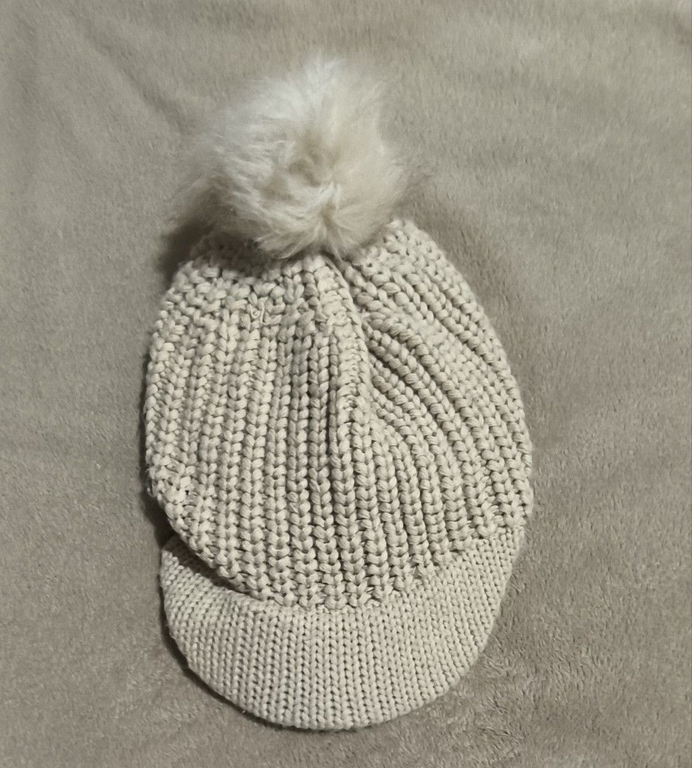 Beige Knitted Bonnet Hat with Fur Ball (Category: Hats & Beanies) located in Dasmarinas. Submitted by modcloset_ph (Listing ID 1409822855, Image 1). Description: .