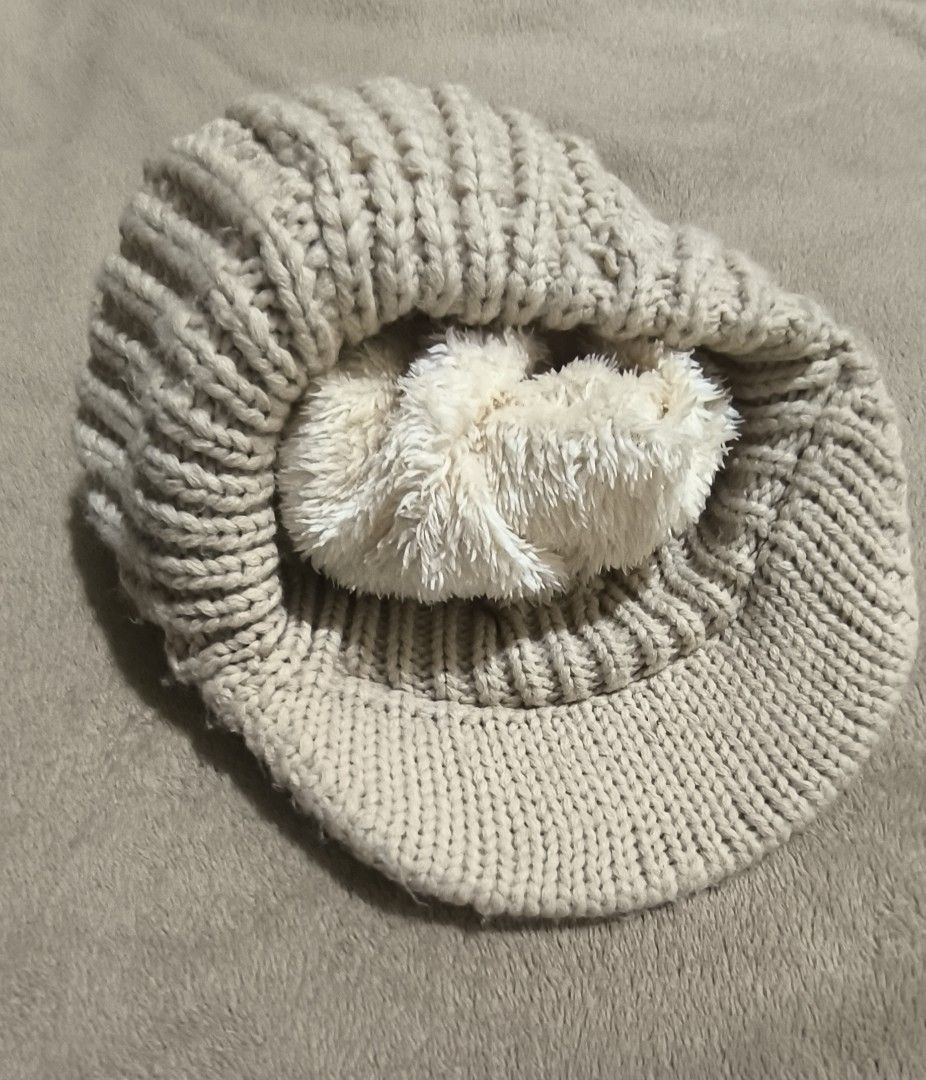 Beige Knitted Bonnet Hat with Fur Ball (Category: Hats & Beanies) located in Dasmarinas. Submitted by modcloset_ph (Listing ID 1409822855, Image 2). Description: .
