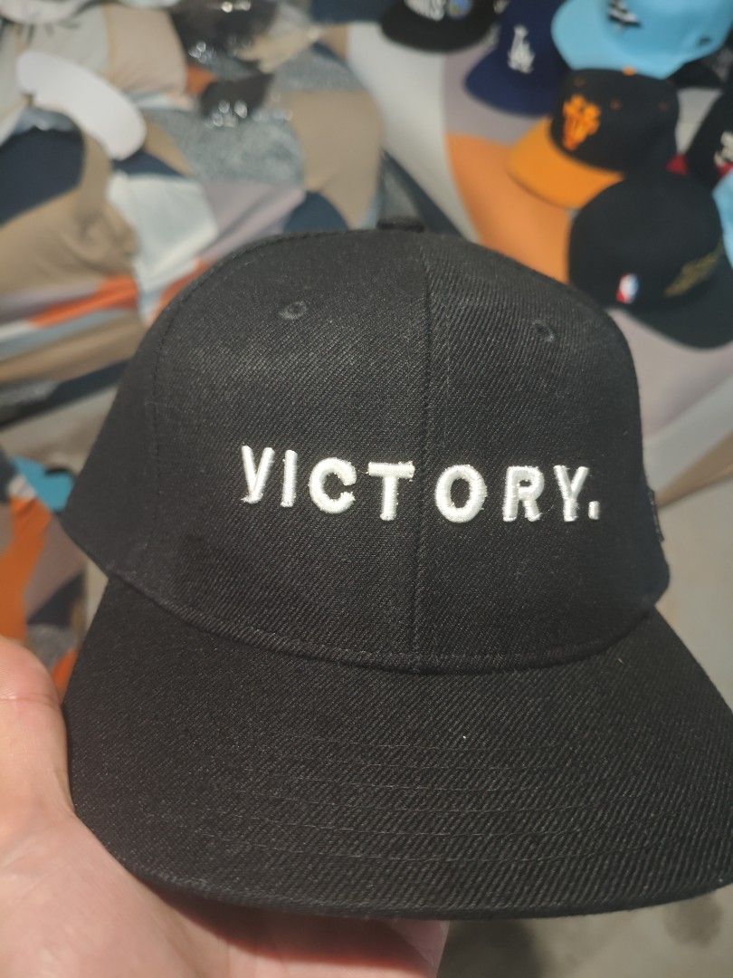 Black Caps with Various Designs (Category: Caps & Hats) located in San Jose del Monte. Submitted by authenticeraph (Listing ID 1409878699, Image 3). Description: - Black caps collection - Designs include: - "VL" logo - "TMC" with American flag - "VICTORY" embroidery - "TMC" in a wreath - "M" - "Gershaw" embroidery.