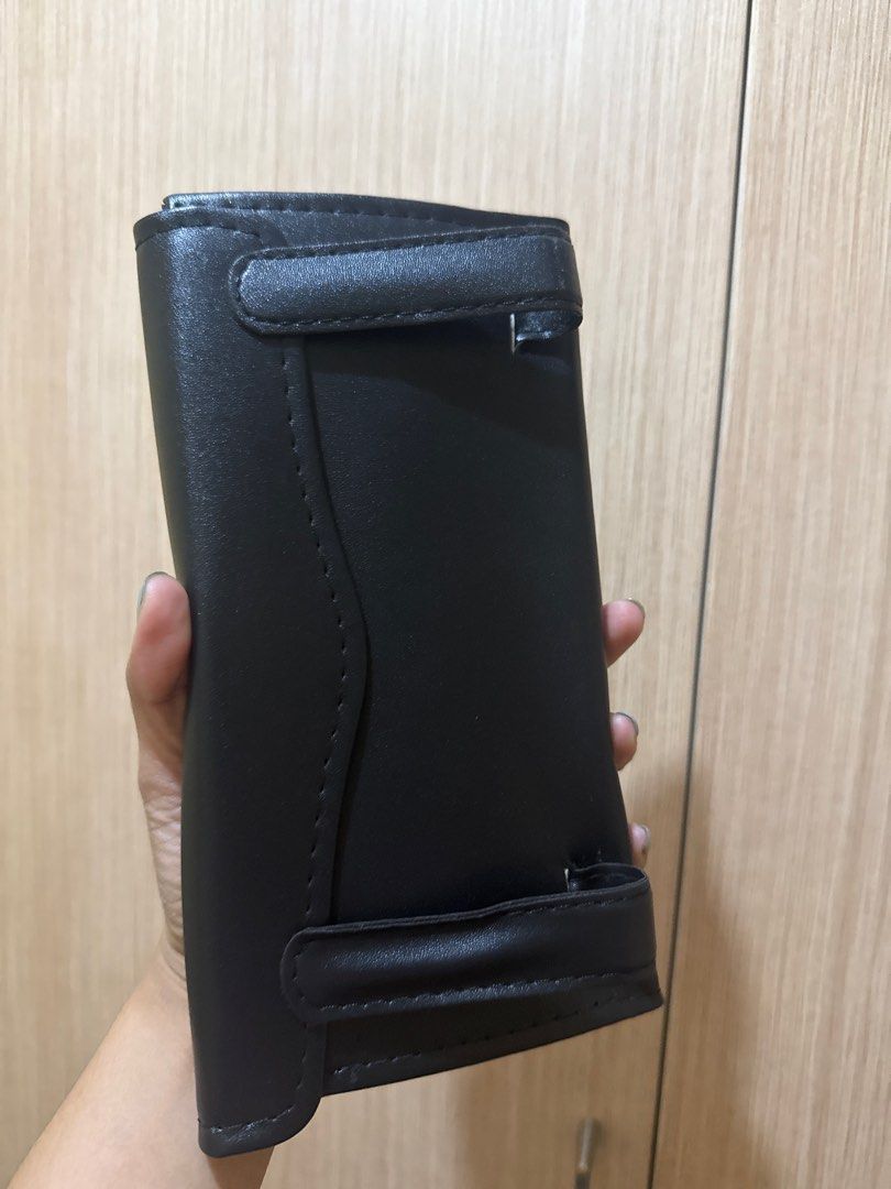Black Leather Tissue Box Holder (Category: Storage Boxes & Baskets) located in Manila. Submitted by bblenshop (Listing ID 1409974895, Image 2). Description: - Black leather tissue box holder - Rectangular shape - Features a cutout for tissue dispensing - Flap closure on the back - Smooth leather material - Visible stitching detail.