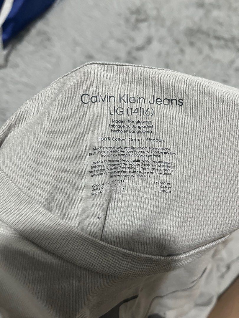 Calvin Klein Jeans T-shirt - Large (Category: Tshirts & Polo Shirts ) located in Pasig City. Submitted by ecfcloset (Listing ID 1409894287, Image 3). Description: - Calvin Klein Jeans T-shirt - Light gray color - Size: Large (14/16) - Features Calvin Klein Jeans logo - Made in Bangladesh - Material: 100% cotton.