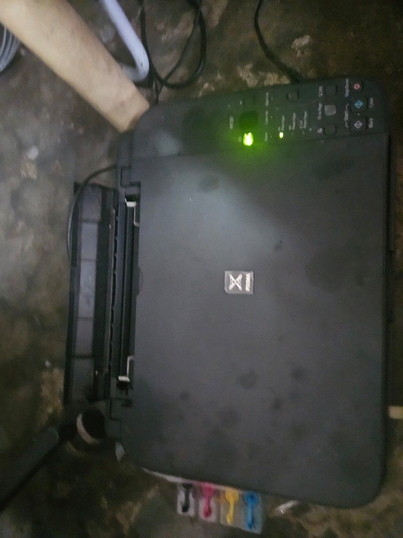 Canon PIXMA MP250 Inkjet Printer (Category: Printers, Scanners & Copiers) located in Caloocan City. Submitted by eunicegerm80358 (Listing ID 1409817002, Image 3). Description: - Canon PIXMA MP250 inkjet printer - External ink tank system included - Comes with ink bottles - Includes power cable - In working condition - Features a flatbed scanner - Color: Black -need to change external ink tank system because clogged - barely used and got a new one