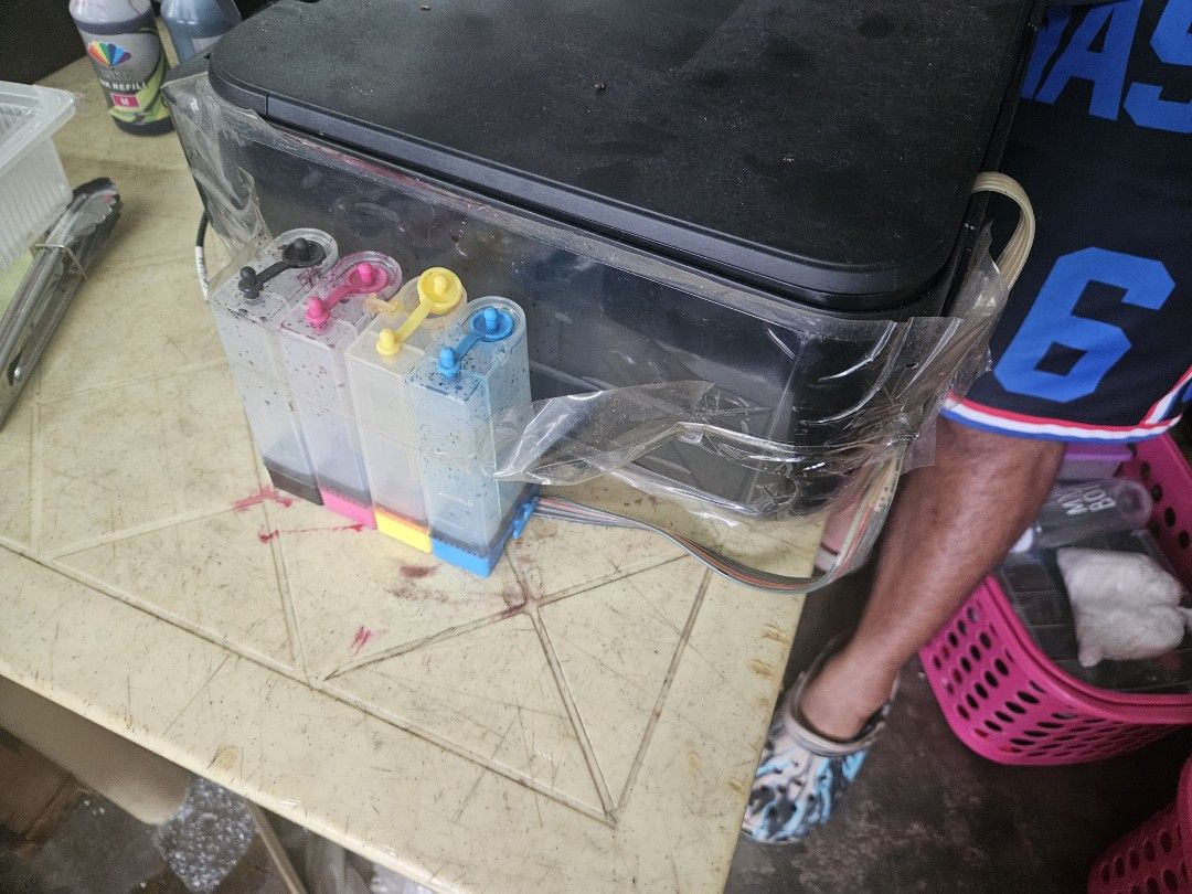 Canon PIXMA MP250 Inkjet Printer (Category: Printers, Scanners & Copiers) located in Caloocan City. Submitted by eunicegerm80358 (Listing ID 1409817002, Image 2). Description: - Canon PIXMA MP250 inkjet printer - External ink tank system included - Comes with ink bottles - Includes power cable - In working condition - Features a flatbed scanner - Color: Black -need to change external ink tank system because clogged - barely used and got a new one