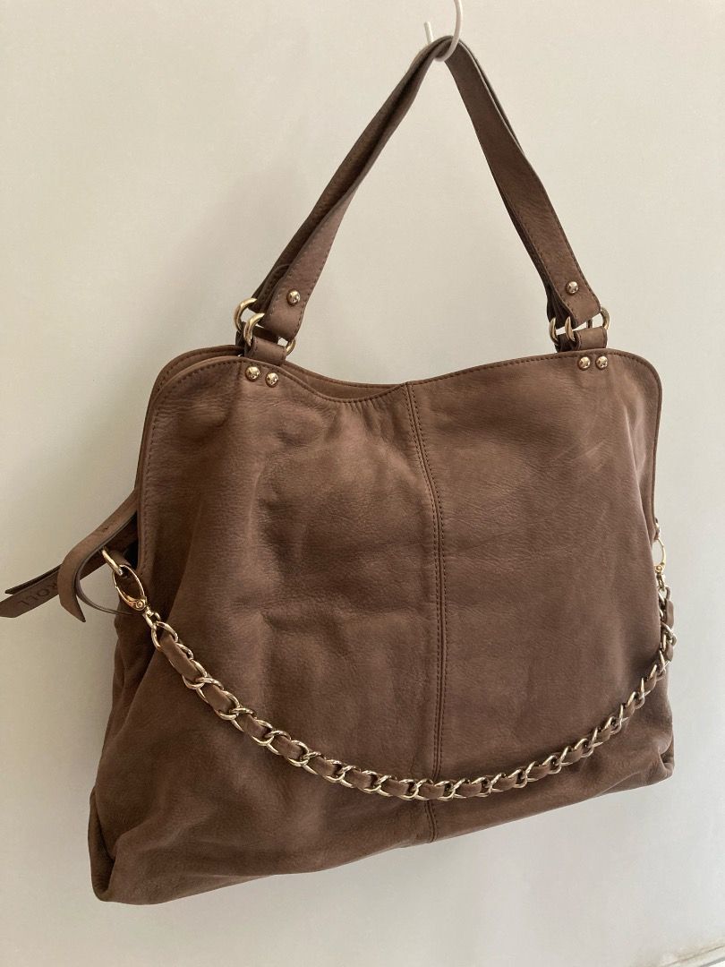 Caroll Brown Handbag with Chain (Category: Luxury Bags & Wallets) located in Quezon City. Submitted by summer2yu2 (Listing ID 1409991229, Image 1). Description: - Stylish Caroll handbag in rich brown - Chain detail - Back zippered pocket - Interior zippered pocket - Brand label - Dual handles and shoulder strap - Approximately 16 inches wide.