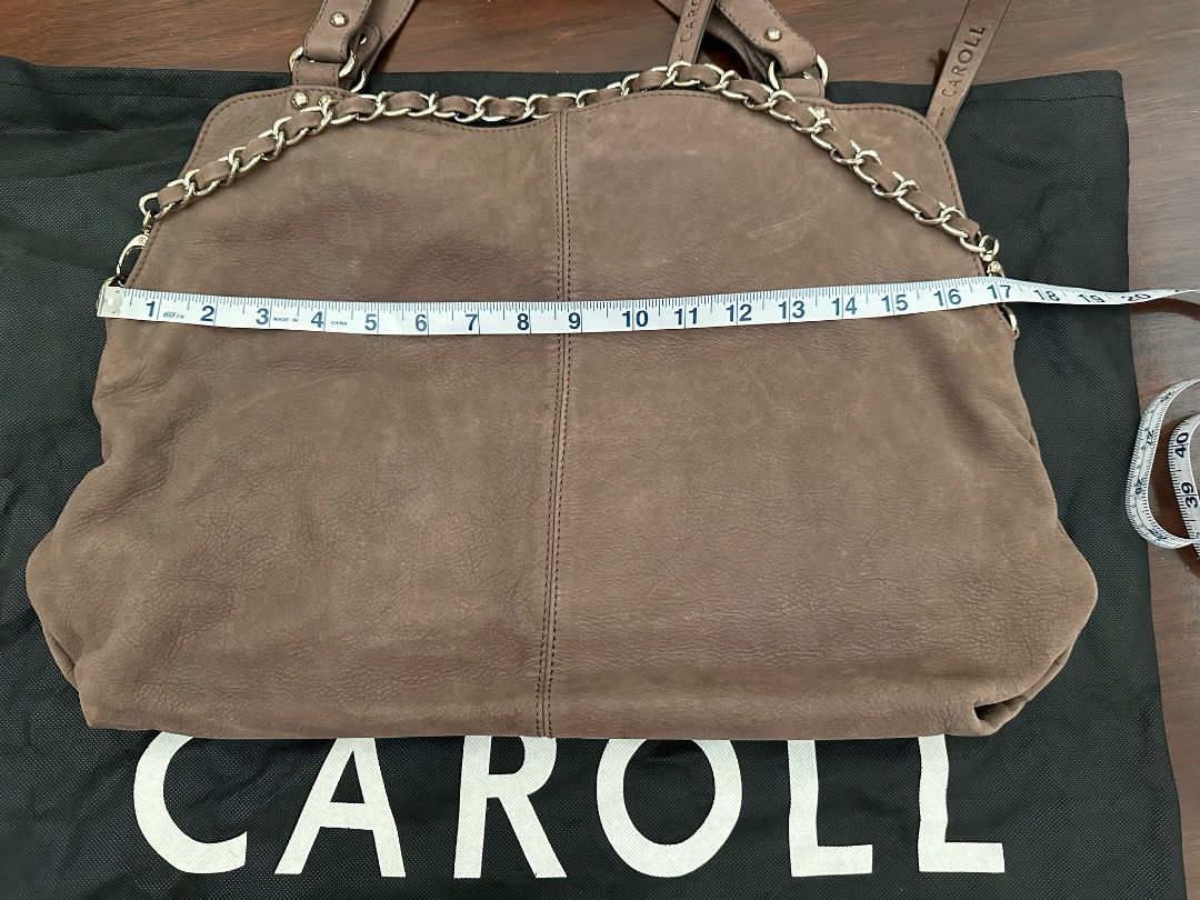Caroll Brown Handbag with Chain (Category: Luxury Bags & Wallets) located in Quezon City. Submitted by summer2yu2 (Listing ID 1409991229, Image 3). Description: - Stylish Caroll handbag in rich brown - Chain detail - Back zippered pocket - Interior zippered pocket - Brand label - Dual handles and shoulder strap - Approximately 16 inches wide.
