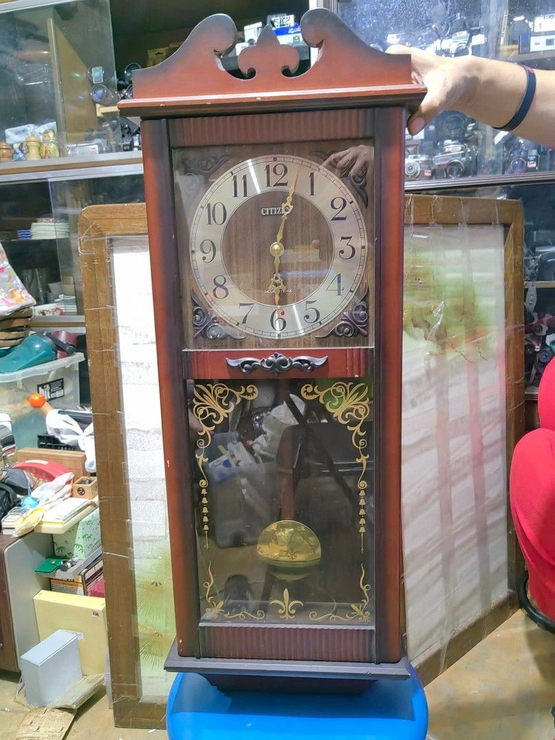 Citizen Pendulum Wallclock Quartz Hour Strike (Category: Clocks) located in Cebu City. Submitted by dudes_villanueva (Listing ID 1409960870, Image 1). Description: Citizen Pendulum Wallclock Quartz Hour Strike 📌In very good condition. Few wood scratch. Can be restored. 📌Working Hourly strike and every 30 minute single strike. 📌1 Type D battery operated. 📌Vintage style look with elegant modern clock face design. 📌Clock is not pendulum depende