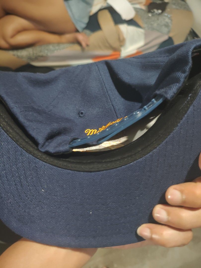 Cleveland Cavaliers Cap (Category: Caps & Hats) located in San Jose del Monte. Submitted by authenticeraph (Listing ID 1409863578, Image 2). Description: - Navy blue Cleveland Cavaliers cap - Team logo on the front - Mitchell & Ness logo on the underside of the brim.