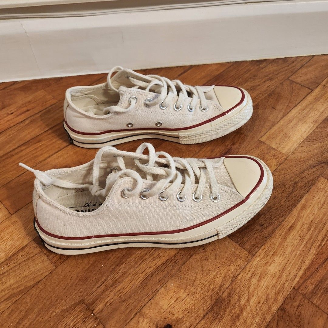 Converse Chuck 70 Low Top Ox/Parchment (Category: Sneakers) located in Makati City. Submitted by catfs (Listing ID 1409808162, Image 2). Description: - Bought in Powerplant Mall. - Cream-colored Converse Chuck 70 Low Top. - Classic design with cream canvas upper. - Red and black midsole accents. - Features the iconic Converse All Star logo. - Size: US Women's 6.5 / Men's 4.5. - Made in Vietnam..