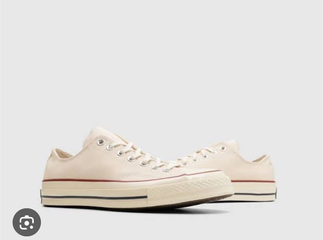Converse Chuck 70 Low Top Ox/Parchment (Category: Sneakers) located in Makati City. Submitted by catfs (Listing ID 1409808162, Image 1). Description: - Bought in Powerplant Mall. - Cream-colored Converse Chuck 70 Low Top. - Classic design with cream canvas upper. - Red and black midsole accents. - Features the iconic Converse All Star logo. - Size: US Women's 6.5 / Men's 4.5. - Made in Vietnam..