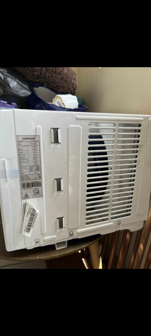 Fabriano Window Type Air Conditioner (Category: Air Conditioning and Heating) located in Pasig City. Submitted by bblossom21 (Listing ID 1409823852, Image 2). Description: - Fabriano window-type air conditioner - Features a digital display - White unit - Non-inverter - 0.5 HP - In good working condition - Includes power cord - Model and serial number visible on the back - Ready for pickup.