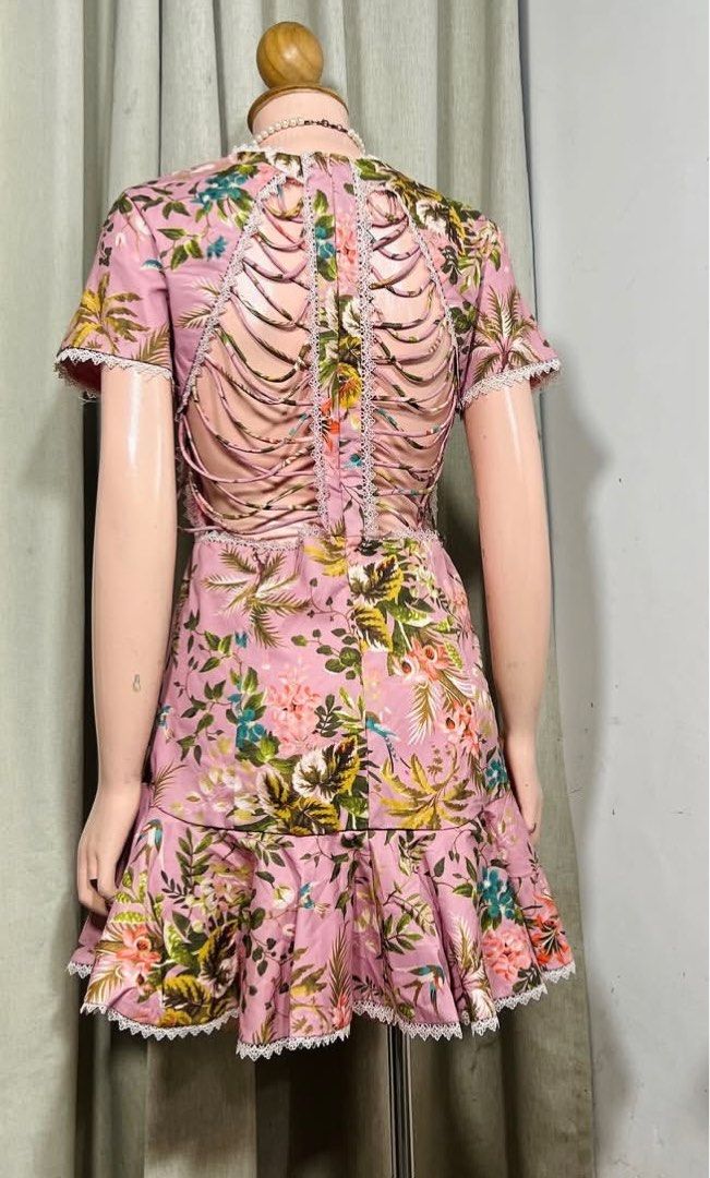 Floral Print Mini Dress (Category: Dresses) located in Cavite. Submitted by eessaa08 (Listing ID 1409901069, Image 3). Description: - Floral mini dress - Pink, green, and yellow floral print - Round neckline - Short sleeves - Ruffled hem - Open back with lace detailing - Lace trim on neckline, sleeves, and hem - Lightweight fabric Size: S-M With inner lining, back zipper opening, knee length for 5ft tall MOP: Gcash MOD: J&T/Lalamove.
