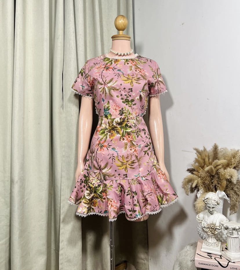 Floral Print Mini Dress (Category: Dresses) located in Cavite. Submitted by eessaa08 (Listing ID 1409901069, Image 1). Description: - Floral mini dress - Pink, green, and yellow floral print - Round neckline - Short sleeves - Ruffled hem - Open back with lace detailing - Lace trim on neckline, sleeves, and hem - Lightweight fabric Size: S-M With inner lining, back zipper opening, knee length for 5ft tall MOP: Gcash MOD: J&T/Lalamove.
