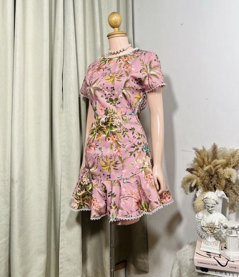 Floral Print Mini Dress (Category: Dresses) located in Cavite. Submitted by eessaa08 (Listing ID 1409901069, Image 2). Description: - Floral mini dress - Pink, green, and yellow floral print - Round neckline - Short sleeves - Ruffled hem - Open back with lace detailing - Lace trim on neckline, sleeves, and hem - Lightweight fabric Size: S-M With inner lining, back zipper opening, knee length for 5ft tall MOP: Gcash MOD: J&T/Lalamove.