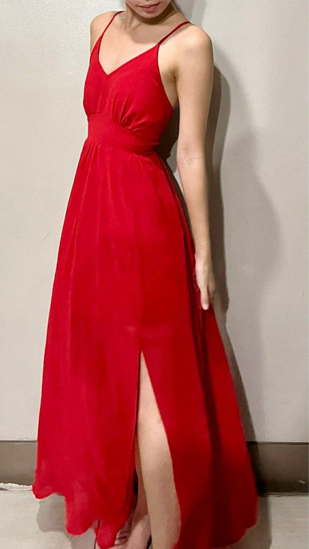 FOR RENT: Red long dress (Category: Dresses) located in San Juan City. Submitted by prelovedstuff_01 (Listing ID 1409935505, Image 1). Description: ₱500 for 3 days + ₱1,500 security deposit (Fully refundable once dress is returned) Additional ₱200 per extra day Features a V-neckline, thin spaghetti straps, front slit, and a lace-up adjustable open back. Perfect for formal events, weddings, proms, dates, or evening occasions. Fit & Size: Fits XS–S