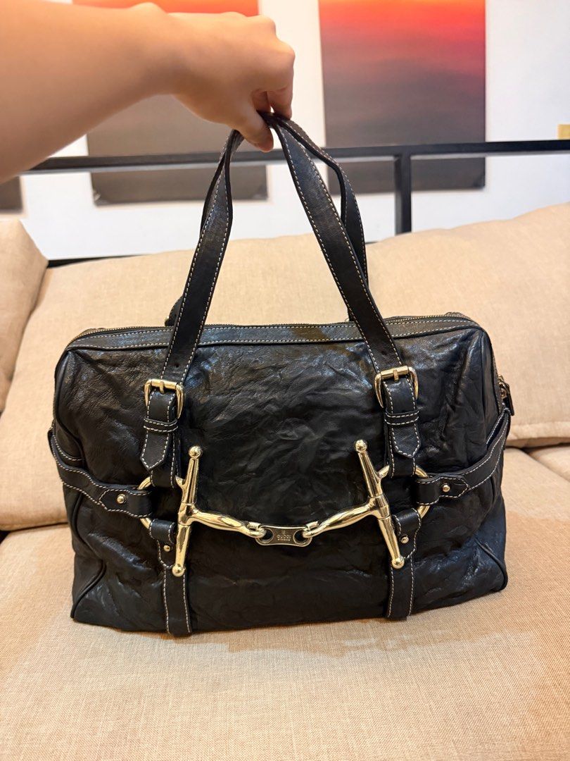 Gucci 85th Anniversary Black Boston Bag (Category: Luxury Bags & Wallets) located in Pasay City. Submitted by karlamarithe (Listing ID 1409975785, Image 3). Description: Gucci 2006 85th Anniversary Black Boston Bag Price: ₱23k -> ₱20k • Reasonable offers only Condition: Vintage | Good Description: Authentic Gucci 85th Anniversary Boston bag in black leather. Classic and rare commemorative design. Condition details (full disclosure): • Natural lea