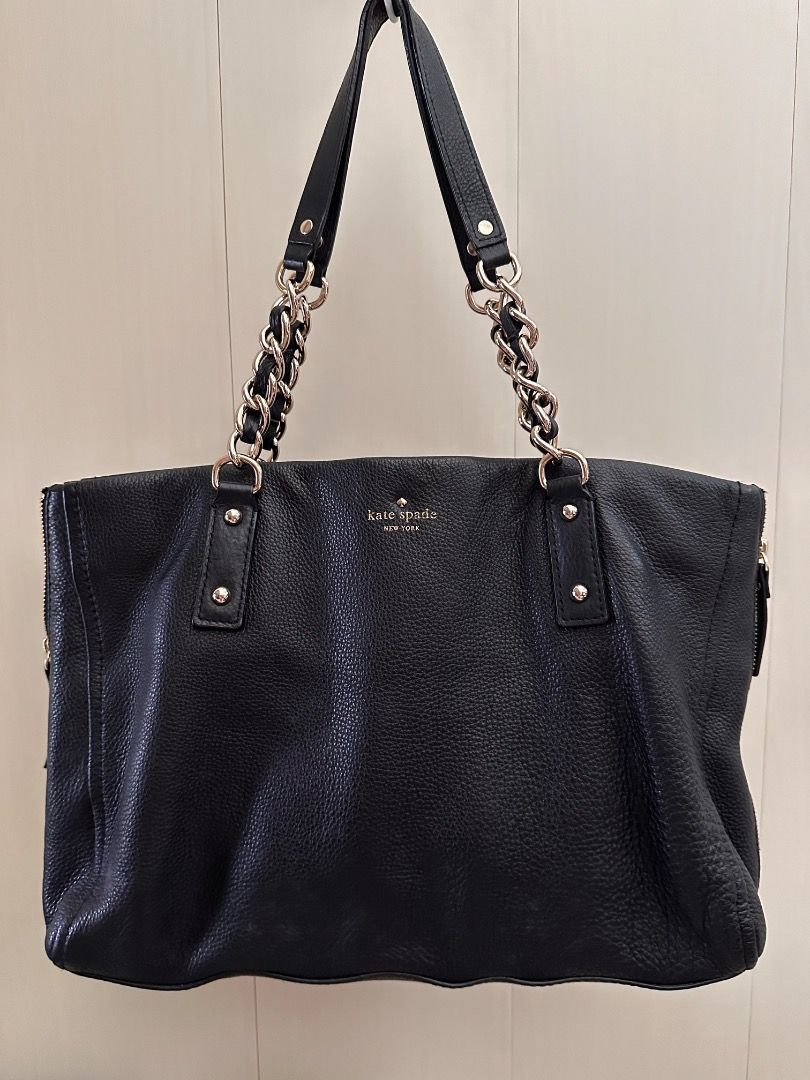 Kate Spade Black Leather Tote Bag (Category: Tote Bags) located in Quezon City. Submitted by summer2yu2 (Listing ID 1409991168, Image 2). Description: - Kate Spade black leather tote bag - Chain strap - Zip closure - Textured leather exterior - Spacious interior - Gold-tone hardware - Kate Spade logo visible.