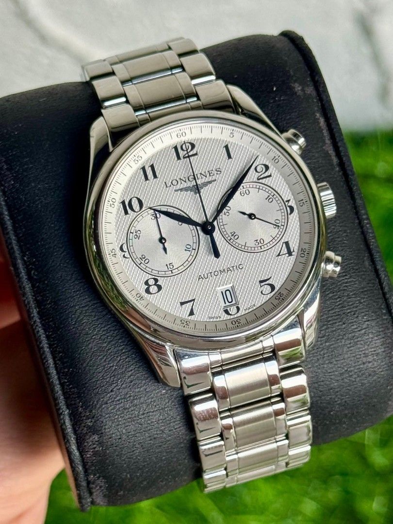 Longines Master Collection Chronograph Automatic Watch (Category: Luxury Watches) located in Taguig. Submitted by jayricafort (Listing ID 1409905649, Image 1). Description: - Longines Master Collection chronograph watch 40mm - Silver dial with chronograph sub-dials - Date display - Automatic movement - Includes original box - Includes warranty card - Includes instruction manual - Stainless steel bracelet - Secure clasp.