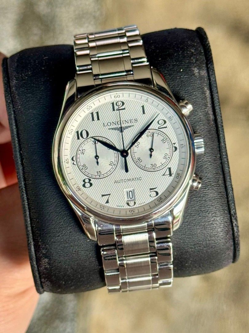 Longines Master Collection Chronograph Automatic Watch (Category: Luxury Watches) located in Taguig. Submitted by jayricafort (Listing ID 1409905649, Image 3). Description: - Longines Master Collection chronograph watch 40mm - Silver dial with chronograph sub-dials - Date display - Automatic movement - Includes original box - Includes warranty card - Includes instruction manual - Stainless steel bracelet - Secure clasp.