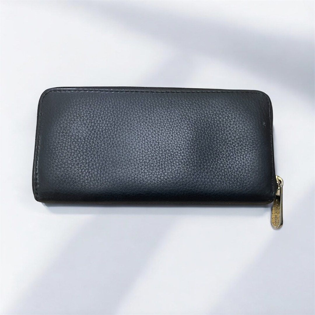 Michael Kors Jet Set Continental Zip-Around Wallet (Category: Wallets & Card holders) located in Santa Rosa. Submitted by yen.ph (Listing ID 1409837999, Image 3). Description: Product Information * Brand: MICHAEL Michael Kors * Style: Jet Set Continental Wallet, zip-around closure * Material: Pebbled or grained leather with a polyester or linen lining * Hardware: Gold-tone finish * Color: Black Features This style of wallet is designed for ample 