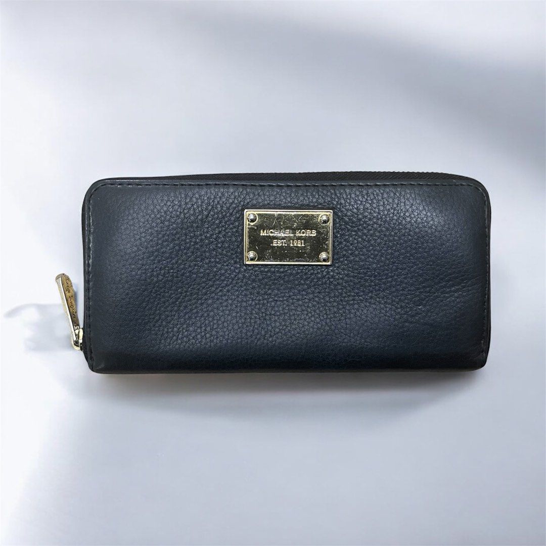 Michael Kors Jet Set Continental Zip-Around Wallet (Category: Wallets & Card holders) located in Santa Rosa. Submitted by yen.ph (Listing ID 1409837999, Image 2). Description: Product Information * Brand: MICHAEL Michael Kors * Style: Jet Set Continental Wallet, zip-around closure * Material: Pebbled or grained leather with a polyester or linen lining * Hardware: Gold-tone finish * Color: Black Features This style of wallet is designed for ample 